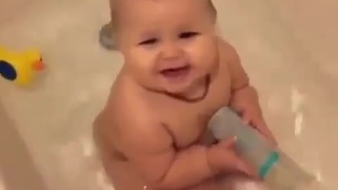 Cute baby playing with water