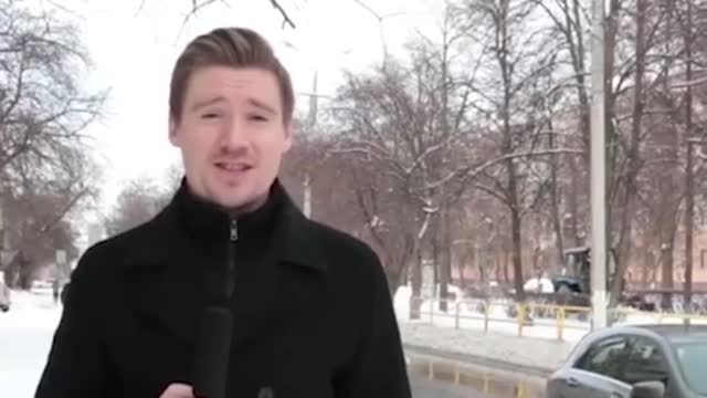 Funny: A Russian woman's antics in front of reporters