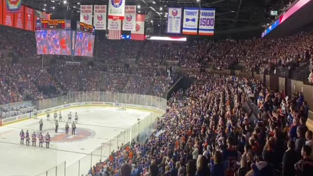 I stand for the National Anthem.