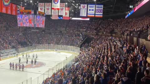 I stand for the National Anthem.