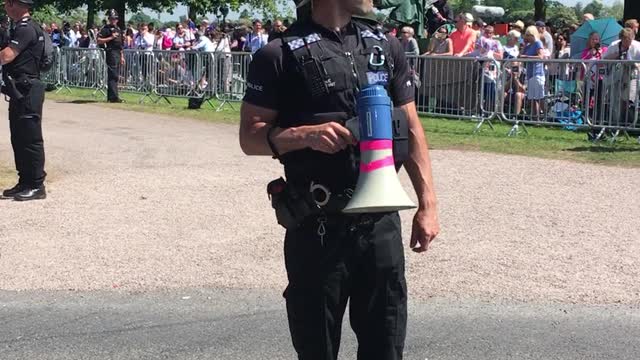 Cheerful Policemen Entertain Crowd While Waiting For Royal Newlyweds