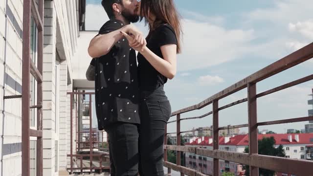 Couple Dancing and Kissing at Balcony