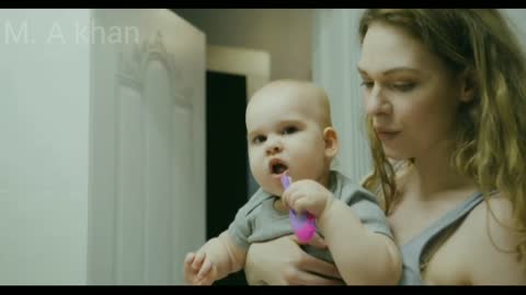 Cute Baby Learning to Brush Teeth