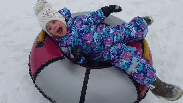 Riding on a donut in the winter