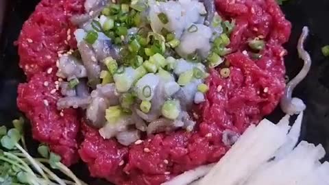 Korean foodCombination of raw beef and raw octopus.