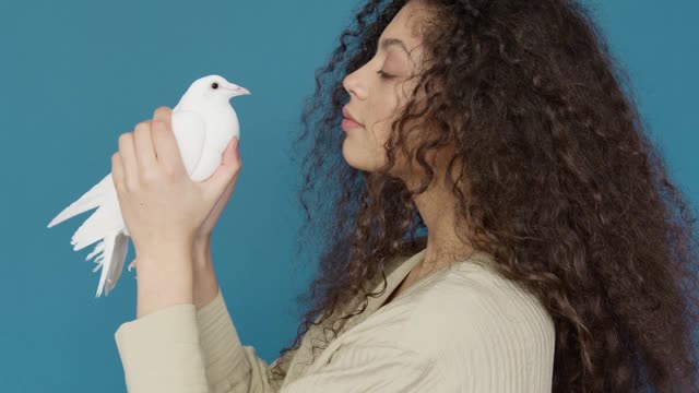 ideo-of-a-woman-looking-a-dove