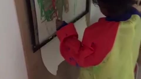 3 year old cutie painting with both hands