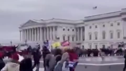 Capitol cop waving people in past the gates