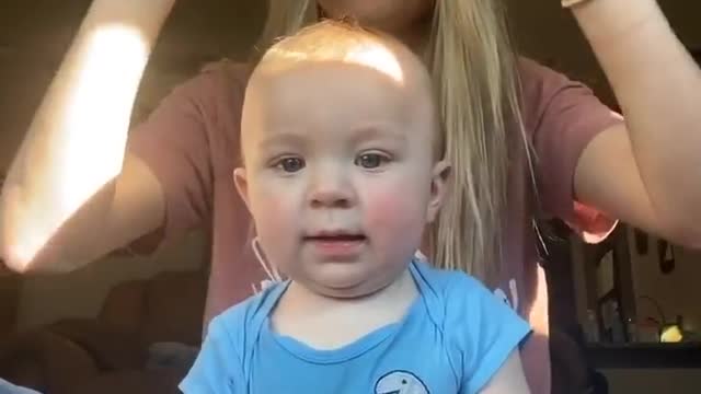 beautiful baby playing with mom