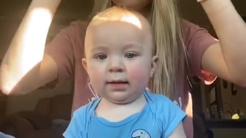 beautiful baby playing with mom