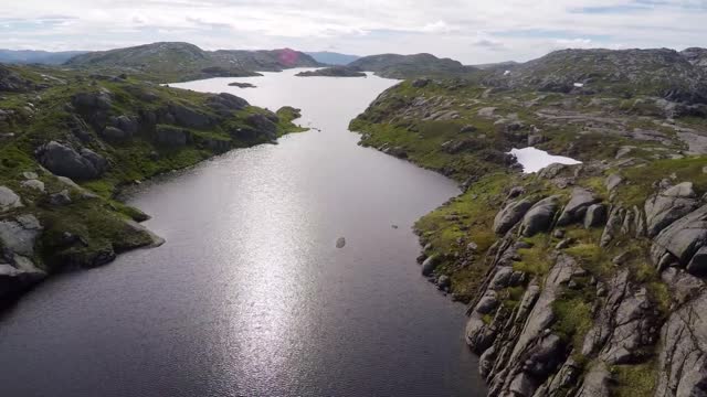 aerial view of mountain plateau and lake high above sea level