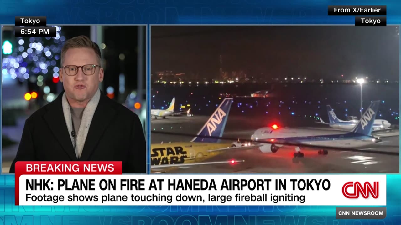 Japan Airlines plane carrying hundreds of passengers burst into flames