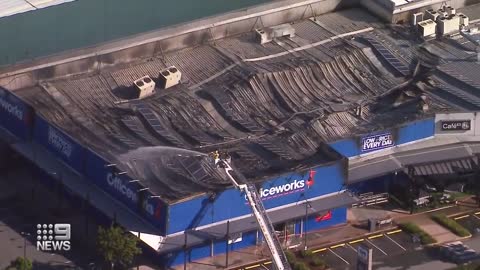 ‘Suspicious fire’ tears through Officeworks for eight hours in Brisbane