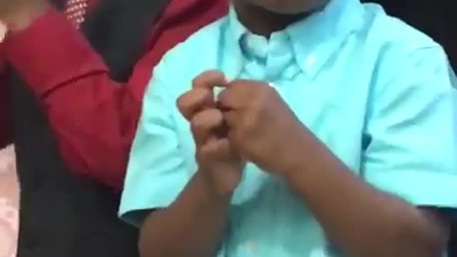 Vibes little boy peeps something and makes a face