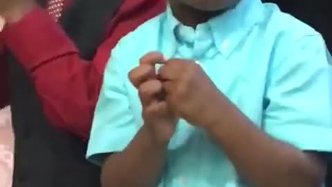 Vibes little boy peeps something and makes a face
