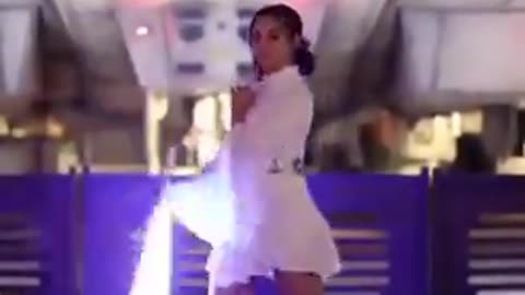 A girl playing with a lightsaber