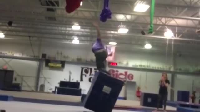 Acrobat backflip loses balance