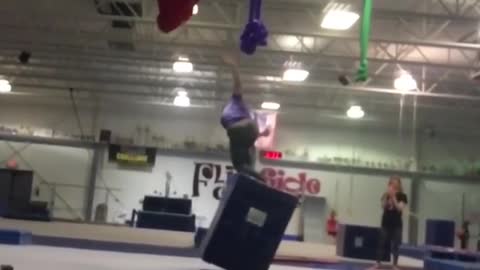 Acrobat backflip loses balance