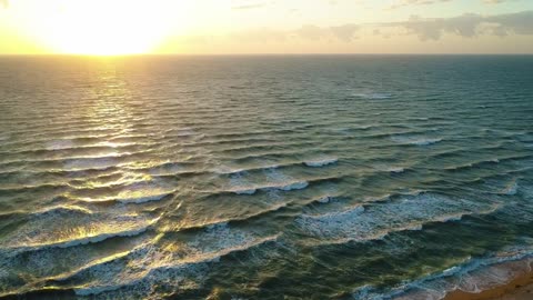 The calm sea at dawn on the seashore