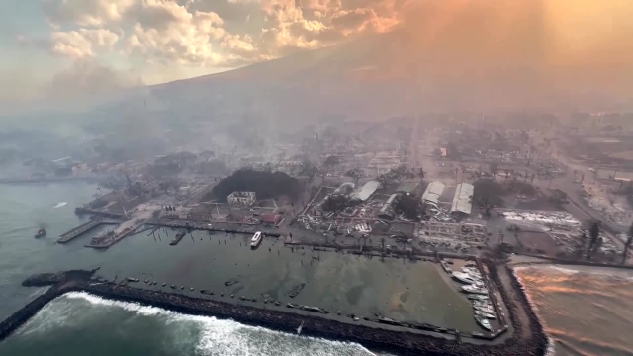 Aerial video over Maui shows smoke rising from fire