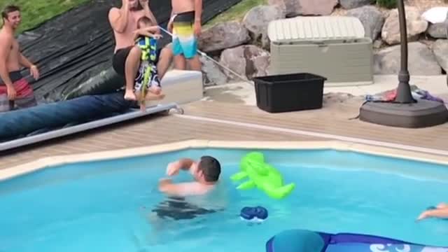 Collab copyright protection - zipline dad drops son into pool