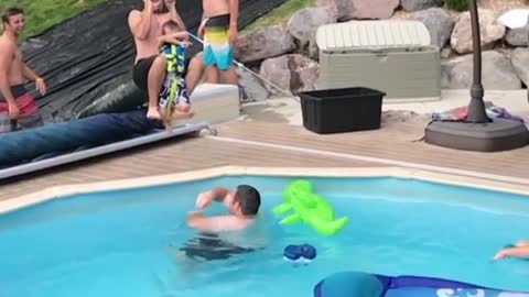 Collab copyright protection - zipline dad drops son into pool