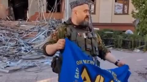 Cossacks show captured Ukrainian banners