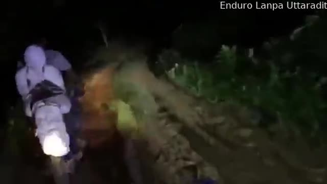 Motorcyclists Transport Body From Forest for Autopsy