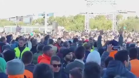 Thousands of people join Italian dock workers to protest against COVID passports in Italy.