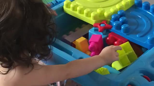 Playing with her lego set