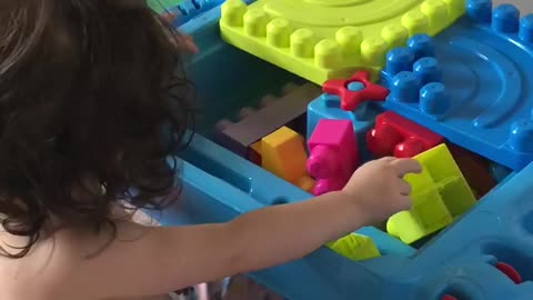 Playing with her lego set