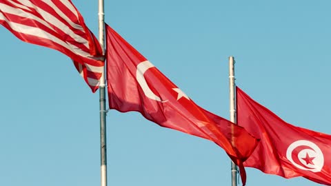 Flags from different countries waving with the wind