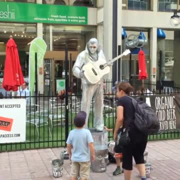 Silver Elvis and a little boy.... Cool!!!!!!