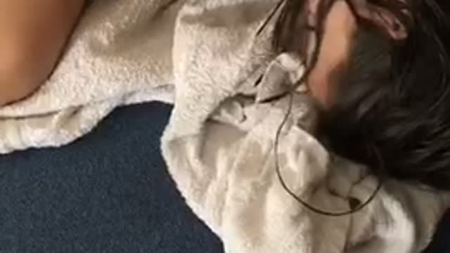 Girl red shirt sits up and then falls asleep and falls back