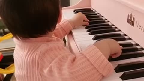 Two years old playing the piano