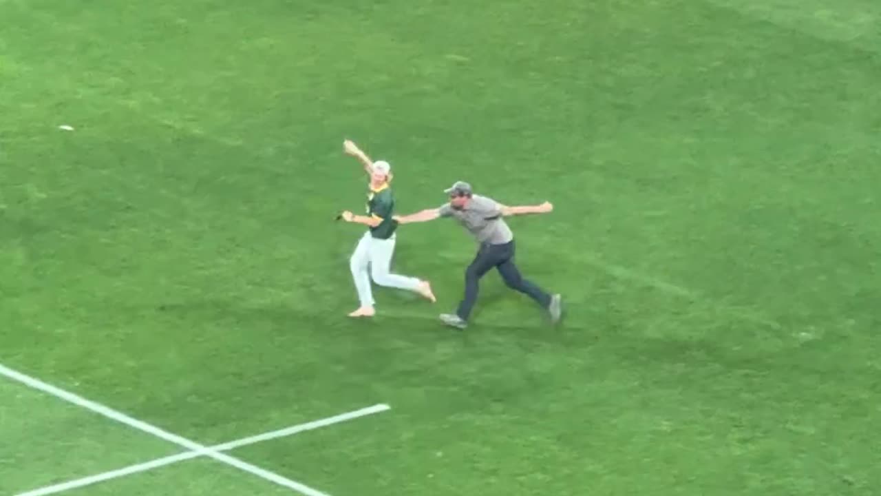 Pitch Invaders Disrupt Prize Ceremony and Get Tackled