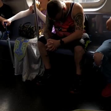 Woman in a blonde princes costume on train