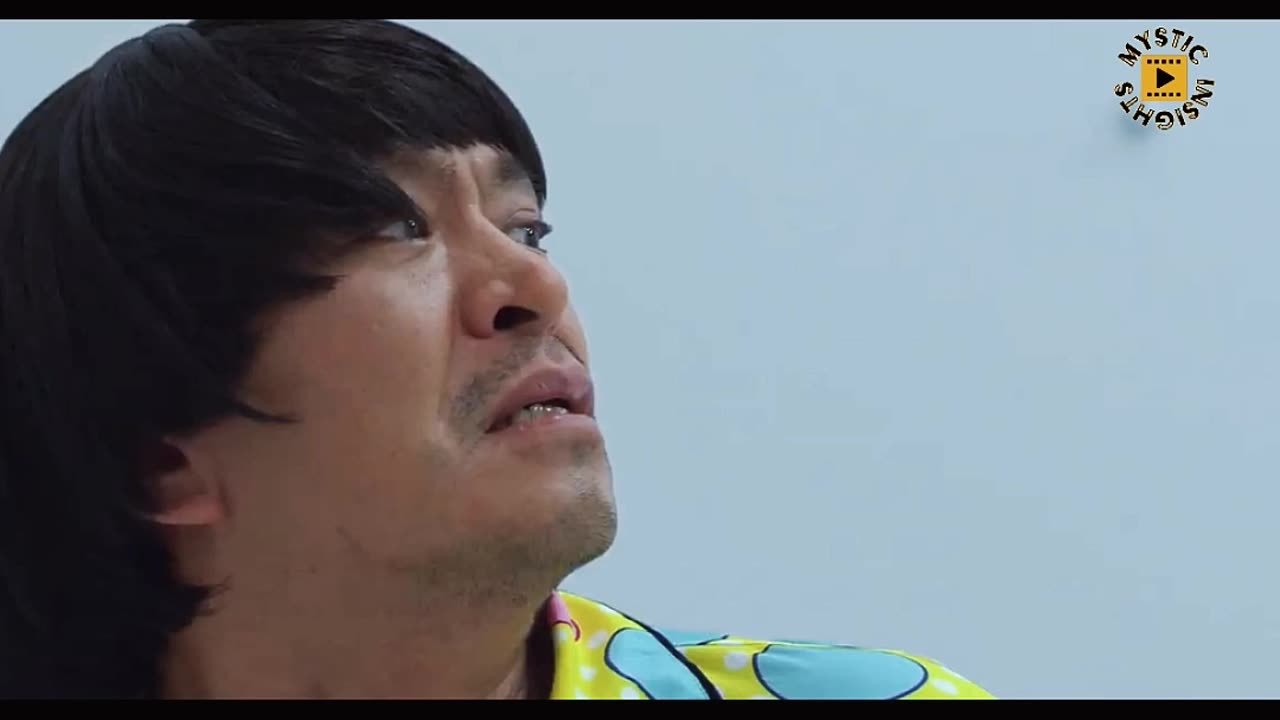 Part 1 Japanese man locked in an unfurnished room, the walls adorned with an array of random button