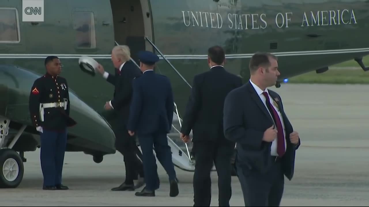 WOW Trump stops to retrieve Marine s hat