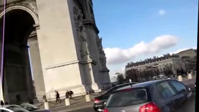 France, Paris - cycling around the Arc de Triomphe 2011