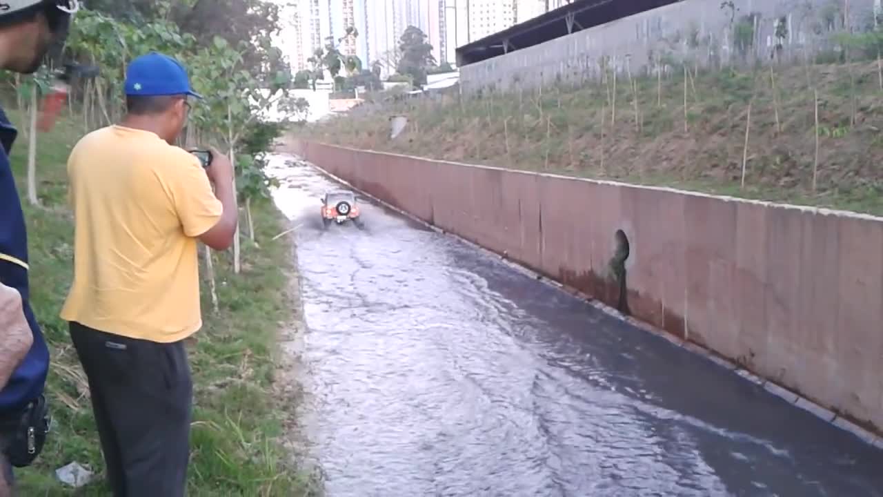 Driving Through Water To Rescue A Dog Stranded In The Middle Of A River