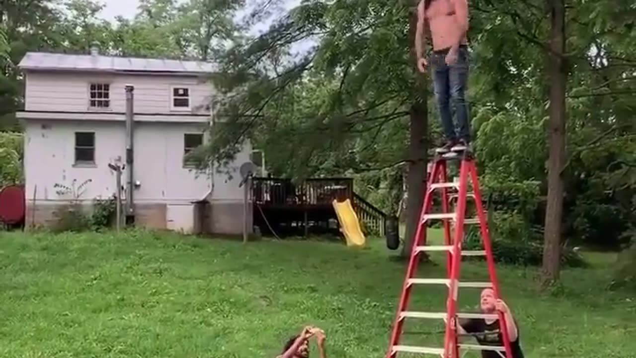 Dude jumps onto a barbed wire trampoline