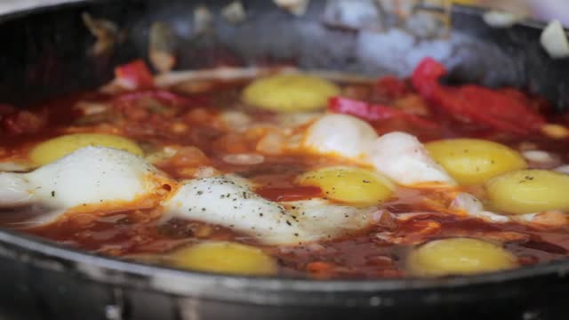 pan cooking eggs shakshukam indian food meal