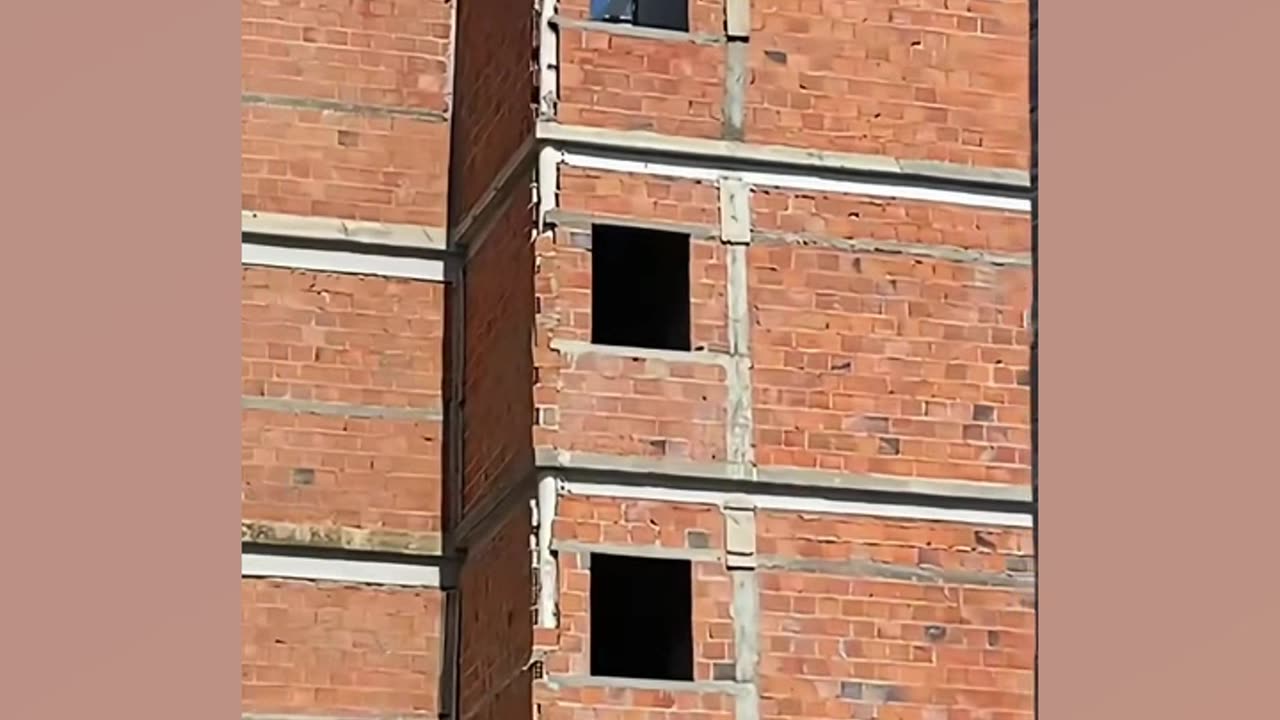 Bricklayer makes structural columns in building using PVC pipe