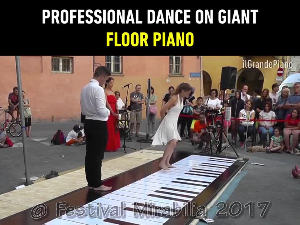 Professional dance on giant floor piano