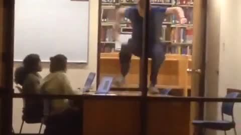 Guy bursts into study room and takes off his clothes in front of two girls