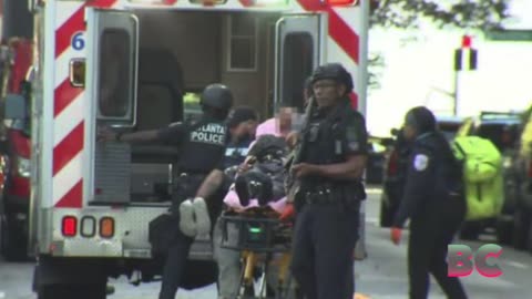 Gunman in Halloween mask opens fire from Atlanta hotel balcony