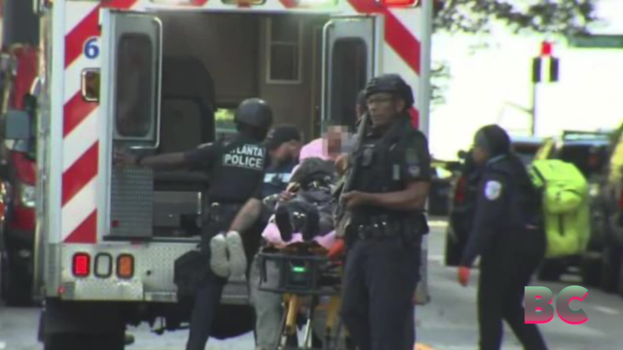 Gunman in Halloween mask opens fire from Atlanta hotel balcony