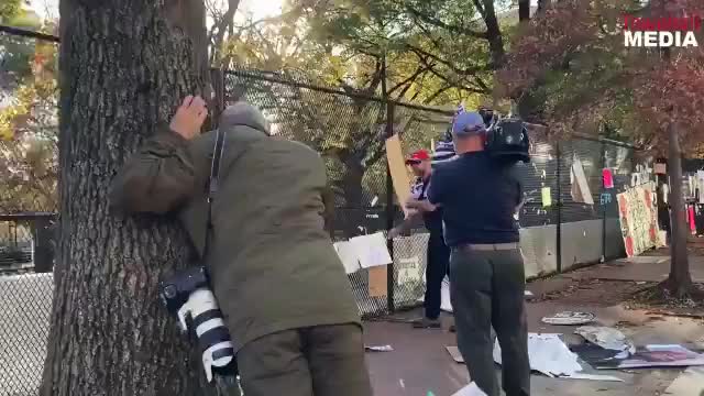 Patriots arriving in DC start taking down BLM and Marxist propaganda.