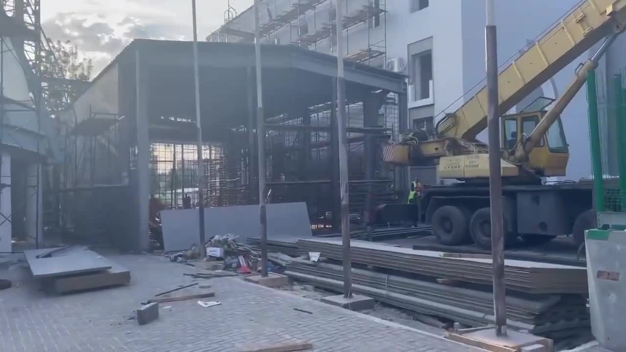 giant cage being erected by Mariupol Theater,for captured Ukrainian soldiers